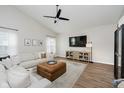 Comfortable living room with vaulted ceilings, modern decor, and entertainment center at 18760 Pilot Mills Dr, Noblesville, IN 46062