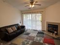 Inviting living room featuring a fireplace, sliding glass doors and neutral tones at 240 Legends Creek Pl # Apt 310, Indianapolis, IN 46229