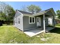 Charming gray home with a covered front porch at 2417 Crystal St, Anderson, IN 46012