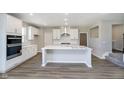 Modern kitchen features white cabinets, an island with seating, and stainless steel appliances at 3256 Fawn Cir, Brownsburg, IN 46112