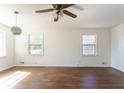 Spacious living room featuring hardwood floors and abundant natural light at 370 N Bazil Ave, Indianapolis, IN 46219