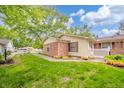 Spacious backyard with lush green lawn, mature trees, and well maintained landscaping at 4316 London Ct, Anderson, IN 46013