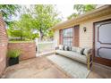 Inviting front porch with stylish seating, greenery, and an eye-catching rug at 4316 London Ct, Anderson, IN 46013