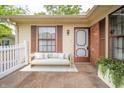Inviting front porch with stylish seating, a new door, and decorative touches at 4316 London Ct, Anderson, IN 46013