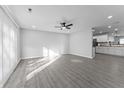 Spacious living area with neutral walls and modern floors offering a bright and airy feel at 4457 Campbell Ave, Indianapolis, IN 46226