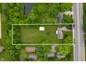 Aerial view of property highlighting expansive lot with mature trees, detached building and ample space at 5330 W 56Th St, Indianapolis, IN 46254