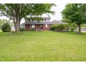 Inviting two-story home features a large front yard and mature trees at 5388 W Hazelrigg Rd, Thorntown, IN 46071