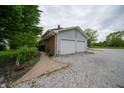 Detached two-car garage with a gravel driveway and easy access at 5388 W Hazelrigg Rd, Thorntown, IN 46071