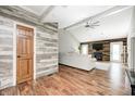 Spacious living room boasting vaulted ceiling, wood-look floors, and cozy fireplace at 555 Echo Bend Blvd, Greenwood, IN 46142