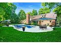 Inviting backyard pool area perfect for outdoor entertaining and relaxation at 6575 Robin Hood Dr, Indianapolis, IN 46227