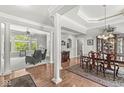 Elegant living space with hardwood floors, large windows, and a formal dining area at 7421 Meadow Violet Ct, Avon, IN 46123