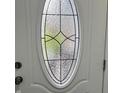 Close up shot of entry door's decorative glass with black trim and metal hardware at 1417 N Belleview Pl, Indianapolis, IN 46222