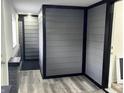 Hallway featuring modern gray walls and flooring with attractive black trim at 1417 N Belleview Pl, Indianapolis, IN 46222