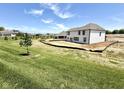Large backyard ready for customization, showcasing a newly constructed white two-story home at 1534 Trichel Dr, Greenwood, IN 46143