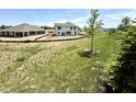 Expansive backyard awaiting landscaping, featuring a modern two-story home with ample space at 1534 Trichel Dr, Greenwood, IN 46143