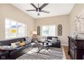 Bright living room with high ceilings, sleek leather sofas, and an electric fireplace at 1609 S G St, Elwood, IN 46036