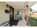 Cozy porch with rocking chairs, dark trim, and space to relax at 1609 S G St, Elwood, IN 46036