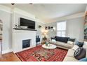 Comfortable living room with a decorative fireplace, plush seating, and ample natural light at 1867 Barth Ave, Indianapolis, IN 46203