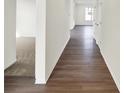Hallway with Hardwood flooring that transitions from Hardwood to carpet in the room on the left at 19762 Highclere Lane, Sheridan, IN 46069