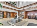 Expansive lobby with upscale decor, unique wood paneling, modern tile and comfortable seating at 225 N New Jersey St # 46, Indianapolis, IN 46204