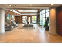 Elegant building lobby with modern tile flooring, plants and plenty of natural light at 225 N New Jersey St # 46, Indianapolis, IN 46204