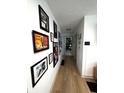 Well-lit hallway featuring hardwood floors and an artfully decorated wall at 426 St Paul St, Indianapolis, IN 46201
