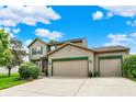 Charming two-story home with a three-car garage, well-manicured landscaping at 5523 Gainesway Dr, Greenwood, IN 46142