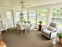 Bright sunroom with multiple windows, casual seating, and a ceiling fan at 641 Lawndale Dr, Plainfield, IN 46168