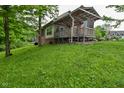 Backyard featuring a partially covered deck at 6567 Kings Ct, Avon, IN 46123