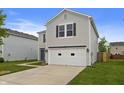 Picture of a two-story house featuring a two-car garage and well-maintained lawn at 8158 S Firefly Dr, Pendleton, IN 46064