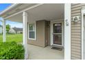Welcoming front porch with classic columns and a neatly trimmed shrub at 8238 Crackling Ln, Indianapolis, IN 46259