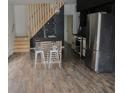 Contemporary kitchen with stainless steel appliances, a wooden island and modern fixtures at 1212 S Senate Ave, Indianapolis, IN 46225