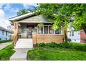 Charming exterior of home showcasing inviting front porch and well kept landscaping at 1426 N Euclid Ave, Indianapolis, IN 46201