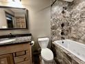 Bathroom features a granite vanity, toilet and a bathtub-shower combination with designer tile at 1570 S Harriet St, Martinsville, IN 46151