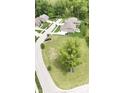 An aerial view of a residential community with well-maintained homes and lush greenery at 1713 Deer Creek Way, Columbus, IN 47201