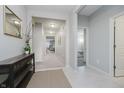 Inviting foyer with neutral walls, tile flooring, and a decorative console table at 18630 Goldwater Rd, Westfield, IN 46062