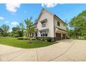 Stunning two-story home featuring an attached two-car garage and lush landscaping at 20400 Chatham Hills Blvd, Westfield, IN 46074