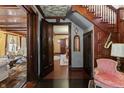 Inviting home entryway featuring dark wood accents, decorative ceiling and views into living spaces at 2134 N Alabama St, Indianapolis, IN 46202