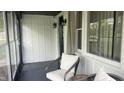 Inviting screened-in porch with comfortable seating, creating a relaxing outdoor living space at 3324 S Walnut St, Muncie, IN 47302