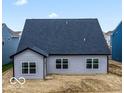 The home features a spacious backyard and exterior with large windows and grey siding at 542 Alder Way, Sheridan, IN 46069