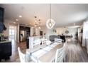 Bright and airy dining area showcases an open layout connecting the kitchen and living spaces at 5824 W Commonview Dr, McCordsville, IN 46055