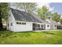 Inviting Cape Cod home with well-kept lawn and quaint front seating, perfect for enjoying the outdoors at 6143 E 43Rd St, Indianapolis, IN 46226