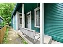Inviting porch with a charming swing, perfect for relaxing and enjoying the outdoors at 631 Prospect St, Indianapolis, IN 46203
