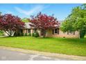 Charming single-story home featuring a well-maintained lawn and mature red maple trees at 6462 Wings Ct, Brownsburg, IN 46112