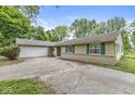 Attractive ranch-style home with an attached garage at 7503 Grandview Dr, Indianapolis, IN 46260