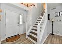 Inviting foyer with staircase and neutral colors, leading to upper level at 7604 Cloudy Ct, Camby, IN 46113