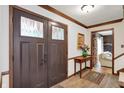 Inviting foyer with double doors, wood accents, and access to the living room at 781 Dayton Dr, Carmel, IN 46033