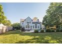 Spacious backyard featuring a sparkling swimming pool, lush greenery, and an inviting patio area at 107 W Columbine Ln, Westfield, IN 46074