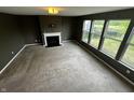 Spacious living room featuring a fireplace and lots of natural light from the many windows at 14462 Brook Meadow Dr, McCordsville, IN 46055