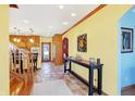 Bright hallway with tile flooring and a view into the kitchen at 186 W 600 N, Alexandria, IN 46001